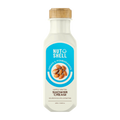 Bottle of Nut to Shell shower cream with a wooden cap on a white background