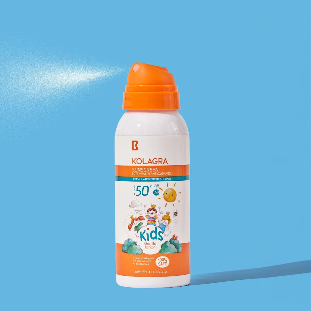 Kolagra sunscreen spray bottle with orange nozzle on a blue background